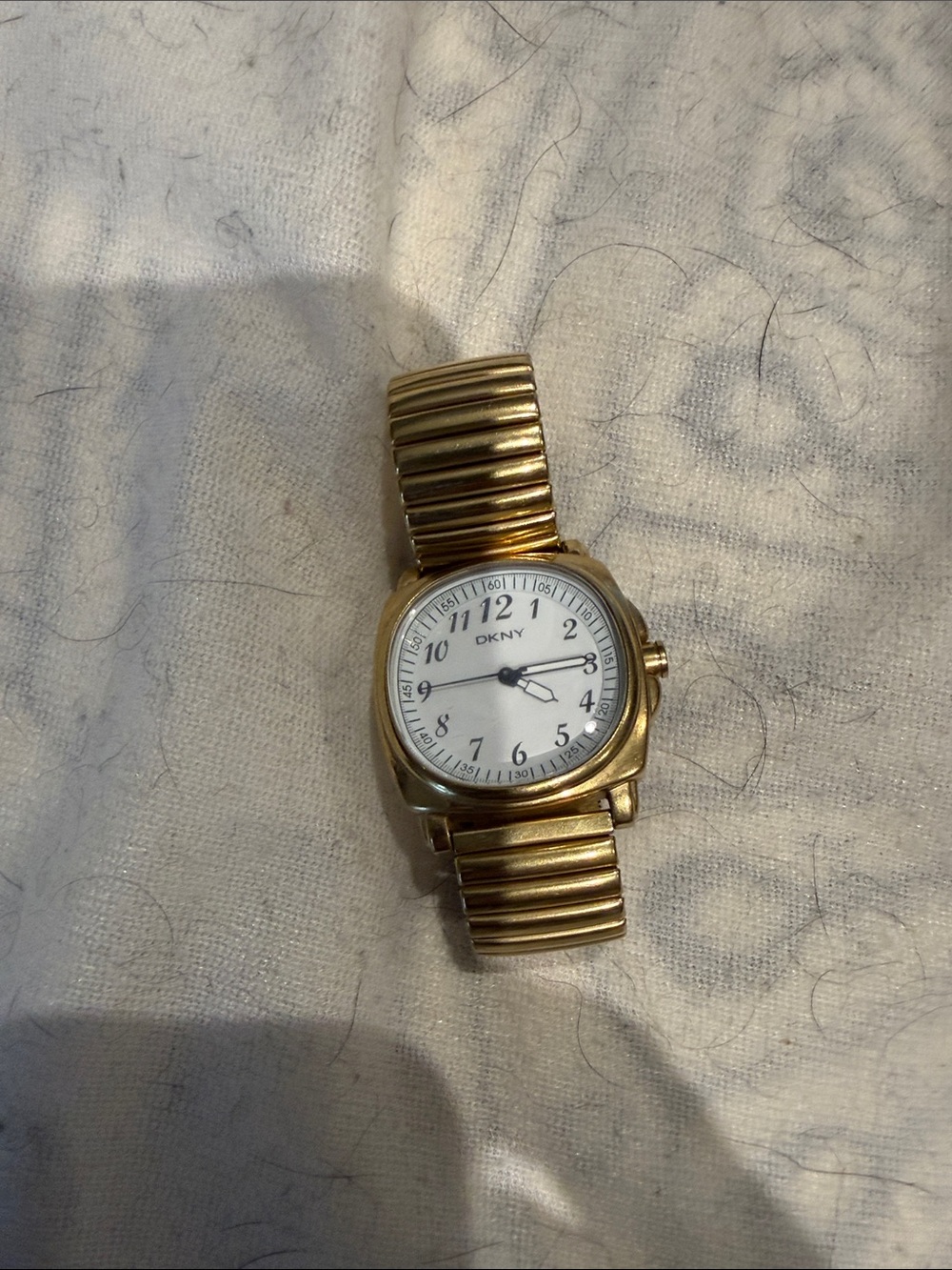 DKNY Gold Tone Stretch Bracelet Watch with White Dial NEEDS BATTERY